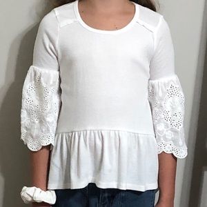 Little girl’s Takara girls white T-shirt.